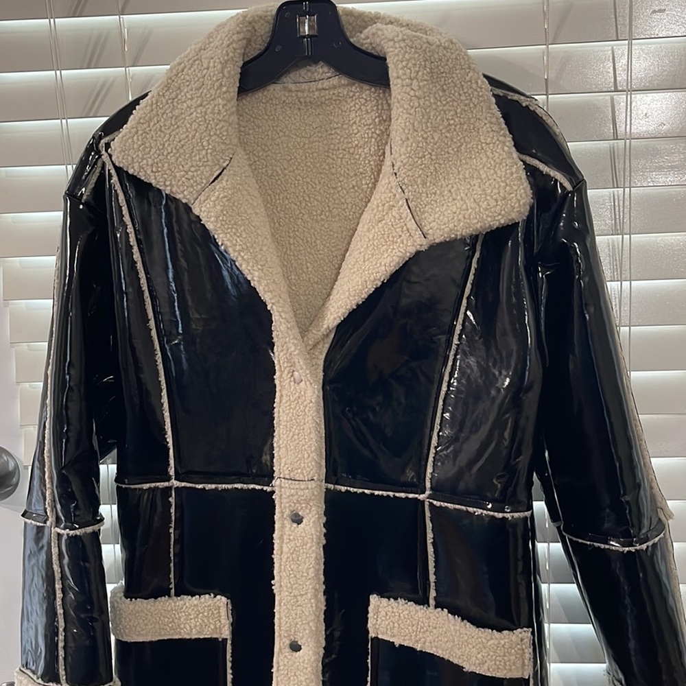 Brand new! Black and Sherpa like lined coat! Never worn! Size small!